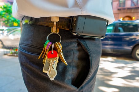 Maintenance staff with a ring of keys on a belt clip to represent the platform Integration options for work orders